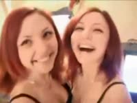 Redhead twins kisses each other while on live